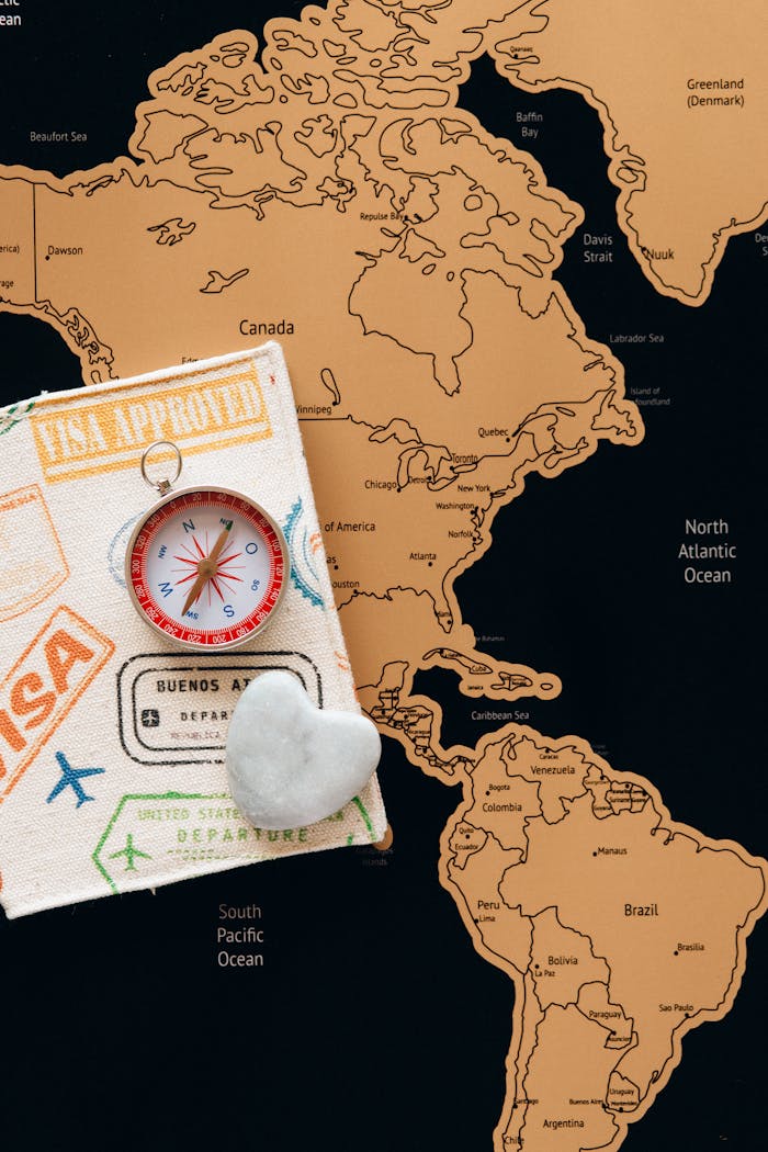 why-choose-us-01 Flat lay photo of a map, passport, and compass, symbolizing travel and adventure.
